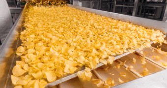 Potato chips production line at food plant